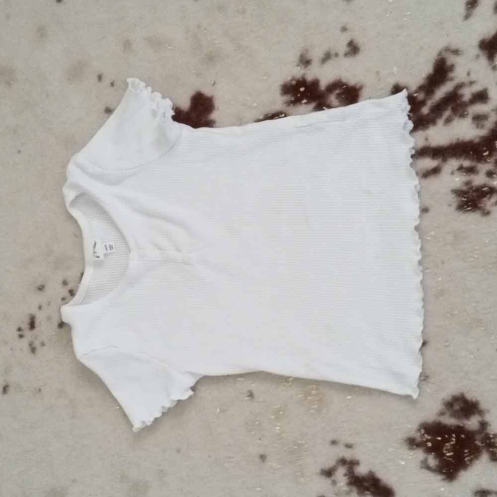A white T-shirt with buttons